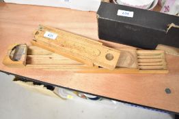 A 20th century artist or stationary container with fold out design and ruler