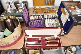 A selection of cutlery and flatwares including carving set