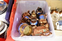 A selection of copper lustre jugs