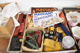 A selection of Meccano parts, motor and Outfit booklets