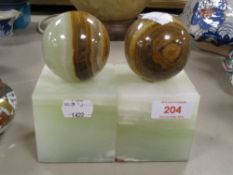 A pair of 20th century agate stone book ends with ball decoration
