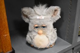 A 2005 Hasbro mechanical toy Furby in grey fur