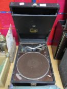 A HMV gramophone with a selection of 78rpm shellac records