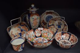 A selection of late 19th century Japanese Imari wares including scalloped bowls, lidded urn and