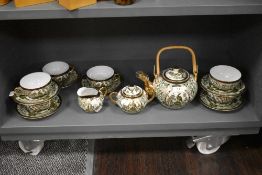 A modern Japanese Saji tea service in a gilt and green pattern