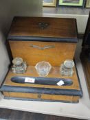 A late Victorian desk top writing or stationary set with drawer storage and ink wells