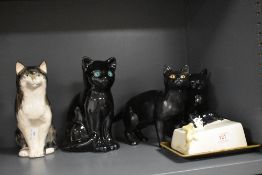 A selection of modern cat figures including Sylvac butter dish, Babbacombe cat figure and Sia cat