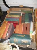 A box of vintage library books including Dickens and Kafka Oscar Wilde and Longfellows