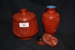 Three pieces of 20th century Chinese Cinnabar lacquer including lidded pot with blue cloisonne