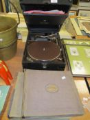 A HMV gramophone record player with a selection of 78rpm shellac records