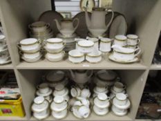A modern Paragon Athena pattern tea dinner and breakfast service over two shelves including tea