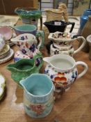 A selection of antique and later Burleigh ware, Masons and similar water and milk jugs.