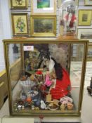 An early 20th century cased peddler doll in case having porcelain head with an assortment of