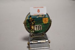 A 20th century desk top revolving calendar with a Scottish design