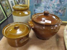 A trio of glazed stoneware items, to include lidded vessels and jar.