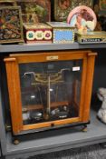 A cased set of Oertling laboratory scales