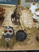 A carved wooden lidded bowl, a pair of Giraffes, a tribal mask and similar.