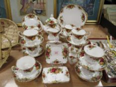 A collection of Royal Albert 'Old Country Roses' cups and saucers, tea pot,sugar, creamer, cake