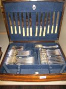 A Mappin and Webb canteen of cutlery in oak case