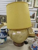 A mid century middle eastern table lamp made from Cammel