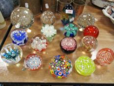 A selection of modern art glass paper weights in various designs including dump style, Millefiori