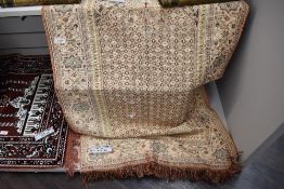 An Oriental fringed rug or hanging.