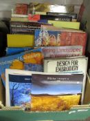 A box of mixed books, predominantly of painting and embroidery interest.