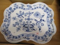 A porcelain serving tray bearing the Meissen mark having scalloped design with a traditional delft