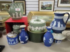 A collection of antique and later Wedgwood Jasperwares including sage green jug and container