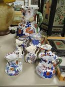 A collection of Victorian and later Mason's water and milk jugs including large jug with snake