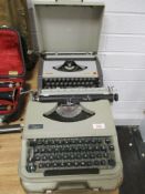 Two vintage type writers, one Simpsons and the other Olivetti.