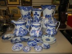 A fine selection of blue and white ware ceramics including graduated Mason's jug set and two large