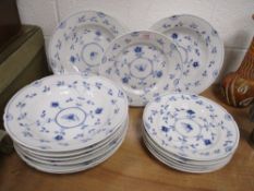 A selection of modern Bing and Grondahl Danish plates and soup bowls having butterfly pattern