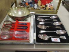 A 20th century Barton silver porringer, with a cased set of enamel tea spoons and a similar set