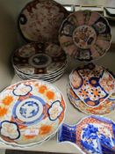 A good selection of antique Japanese Imari wares including fish shape bowl, scalloped plates and
