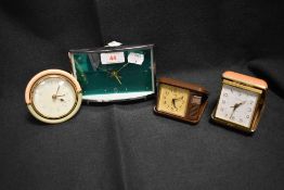 Four 20th century portable alarm clocks including Lorus and Estyma