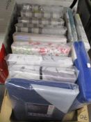 A box full of unused bedding, including single, double and kingsize duvet sets.