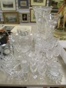 A selection of 20th century clear cut crystal glass wares including a Waterford clock, Sherry