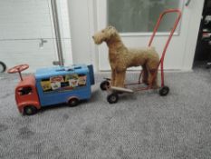 A Triang tin plate Ride On Advertising Wagon having blue body with adverts to both sides and red cab