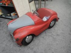 A 1960's Austin Junior J40 Pedal Car in red with grey bonnet and boot, black tyres with chrome hubs