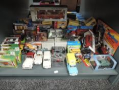 A shelf of modern diecasts including Joal, Burago, Atlas etc, some boxed, 50+