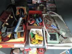 A shelf of vintage Toys including Triang 00 gauge part Train Set, Wrenn part Slot Racing Set,