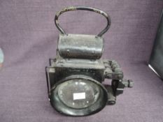 A Railway related Hand Lamp converted to electric having clear lens and side glass with fastening