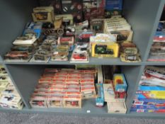 Two shelves of modern diecasts including Lledo Days Gone, Corgi, Models of Yesteryear, Majorette and