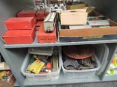 Two shelves of Hornby 0 gauge including No501 Train Set, Crane Truck, Town Station, Petrol Tanker,