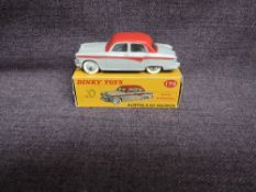A Dinky diecast, 176 Austin A105 Saloon, Red & Grey in original correct spot box