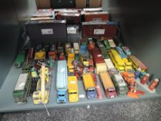 A shelf of playworn Dinky, Corgi, Matchbox and similar diecasts, Military, Construction, Car