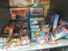 A shelf of mixed vintage Matchbox diecasts including Thunderbirds, 007, Superkings etc, all boxed or