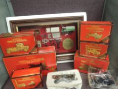 A shelf of Matchbox Models of Yesteryear diecasts including framed Yorkshire Steam Wagon and similar