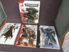 A Games Workshop Warhammer 40,000 three volume set, In The Grim Darkness Of The Future There Is Only